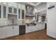 Modern kitchen with white cabinets, marble countertops and stainless steel appliances at 7056 E Mighty Saguaro Way, Scottsdale, AZ 85266