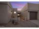 A walkway leads to the front entrance of a contemporary home with a two-car garage at 7056 E Mighty Saguaro Way, Scottsdale, AZ 85266