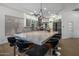 Gourmet kitchen with expansive island and high-end appliances at 7056 E Mighty Saguaro Way, Scottsdale, AZ 85266