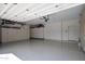 Finished garage with overhead storage and epoxy flooring at 7056 E Mighty Saguaro Way, Scottsdale, AZ 85266