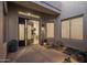 A courtyard entry features a modern front door and potted plants at 7056 E Mighty Saguaro Way, Scottsdale, AZ 85266