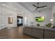 Spacious living area with light wood floors and sectional sofa at 7056 E Mighty Saguaro Way, Scottsdale, AZ 85266