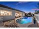 Inviting pool area with a kidney-shaped pool and a relaxing patio setting at 7056 E Mighty Saguaro Way, Scottsdale, AZ 85266