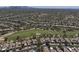 Aerial view of a community with golf course and numerous houses at 7056 E Mighty Saguaro Way, Scottsdale, AZ 85266