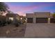 Modern home exterior at dusk with desert landscaping at 7056 E Mighty Saguaro Way, Scottsdale, AZ 85266