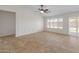 Open living room with tile floors and lots of natural light at 17613 N Kimberly Way, Surprise, AZ 85374