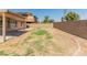 Large backyard with grassy area and gravel border at 17613 N Kimberly Way, Surprise, AZ 85374