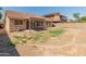 Large backyard with grassy area and gravel border at 17613 N Kimberly Way, Surprise, AZ 85374