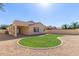 Landscaped backyard with grassy area and gravel at 864 E Riviera Pl, Chandler, AZ 85249