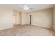 Bright bedroom with tile flooring, ceiling fan, and spacious closet at 864 E Riviera Pl, Chandler, AZ 85249