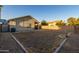 Backyard with a grassy area and block wall at 1425 E Leslie Ave, San Tan Valley, AZ 85140