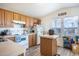 Bright kitchen with wood cabinets, island, and white appliances at 2601 E Allred Ave # Br24, Mesa, AZ 85204