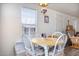 Bright dining area with white table and four chairs at 2601 E Allred Ave # Br24, Mesa, AZ 85204