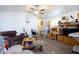 Cozy living room with comfy seating, wood floors, and built-in shelving at 2601 E Allred Ave # Br24, Mesa, AZ 85204
