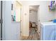 Hallway view of laundry and bedroom with wood flooring at 2601 E Allred Ave # Br24, Mesa, AZ 85204