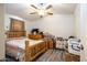 Main bedroom with wooden bed frame and neutral decor at 2601 E Allred Ave # Br24, Mesa, AZ 85204