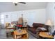 Living room with a couch, chair, and various wooden tables at 2601 E Allred Ave # Br24, Mesa, AZ 85204