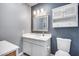 Simple bathroom with white vanity, toilet and updated fixtures at 5013 E Mesquite Wood Ct, Phoenix, AZ 85044