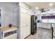 White kitchen with black appliances and ample cabinet space at 5013 E Mesquite Wood Ct, Phoenix, AZ 85044