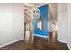 Bright dining room with hardwood floors and blue accent wall at 6120 N 31St Ct, Phoenix, AZ 85016