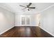 Spacious living room featuring hardwood floors and French doors at 6120 N 31St Ct, Phoenix, AZ 85016