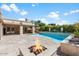 Stunning pool and patio with fire pit and outdoor seating at 6120 N 31St Ct, Phoenix, AZ 85016