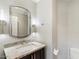 Modern bathroom with granite countertop, updated vanity, and toilet at 6120 N 31St Ct, Phoenix, AZ 85016