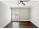 Well-lit bedroom with hardwood floors and plantation shutters at 6120 N 31St Ct, Phoenix, AZ 85016
