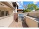 Outdoor kitchen with built-in grill and granite counters at 6120 N 31St Ct, Phoenix, AZ 85016