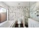 Spa-like bathroom with soaking tub, walk-in shower, and marble tile at 6120 N 31St Ct, Phoenix, AZ 85016