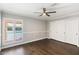 Bright bedroom with hardwood floors, large closet, and pool view at 6120 N 31St Ct, Phoenix, AZ 85016