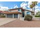 Two-story house with three-car garage and desert landscaping at 15828 N 10Th Pl, Phoenix, AZ 85022