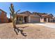 Single-story house with a two-car garage and desert landscaping at 7221 W Globe Ave, Phoenix, AZ 85043