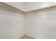 Large closet with wood shelving and tile flooring at 7221 W Globe Ave, Phoenix, AZ 85043