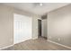 Bedroom with double doors and ceiling fan at 7221 W Globe Ave, Phoenix, AZ 85043