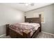 Spacious bedroom with a ceiling fan and large bed at 7221 W Globe Ave, Phoenix, AZ 85043