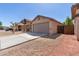 Single-story house with a two-car garage and desert landscaping at 7221 W Globe Ave, Phoenix, AZ 85043