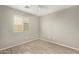 Bright bedroom with wood-look floors and ceiling fan at 7221 W Globe Ave, Phoenix, AZ 85043