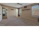 Bedroom with neutral walls and carpeting, and access to another bedroom at 16403 W Baden Ave, Goodyear, AZ 85338