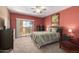 Bedroom with a bed, dresser, and access to a balcony at 19400 N Westbrook Pkwy # 220, Peoria, AZ 85382