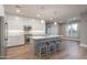 Modern kitchen with white cabinets, island, and stainless steel appliances at 0 W Pima Rd, Maricopa, AZ 85139
