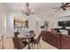 Bright dining area with table, chairs, and open kitchen view at 7232 E Eclipse Dr, Scottsdale, AZ 85266