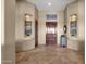 Bright entryway with tile floors, recessed niches, and a wood door at 127 E Sabrosa Dr, New River, AZ 85087