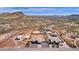 Aerial view showing two homes on a large lot with mountain views at 127 E Sabrosa Dr, New River, AZ 85087