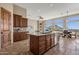 Island kitchen with stainless steel appliances and mountain views at 127 E Sabrosa Dr, New River, AZ 85087