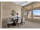 Elegant dining room with large windows and mountain views at 127 E Sabrosa Dr, New River, AZ 85087