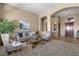 Open living room with neutral color palette and natural light at 127 E Sabrosa Dr, New River, AZ 85087