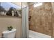 Bathroom with tiled shower and bathtub at 127 E Sabrosa Dr, New River, AZ 85087