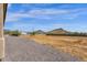 Large backyard with gravel and distant mountain views at 127 E Sabrosa Dr, New River, AZ 85087