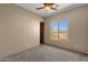 Bright bedroom with neutral carpeting and mountain views at 127 E Sabrosa Dr, New River, AZ 85087